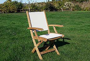 photo of quality teak armchair shown outdoors on beachfront lawn